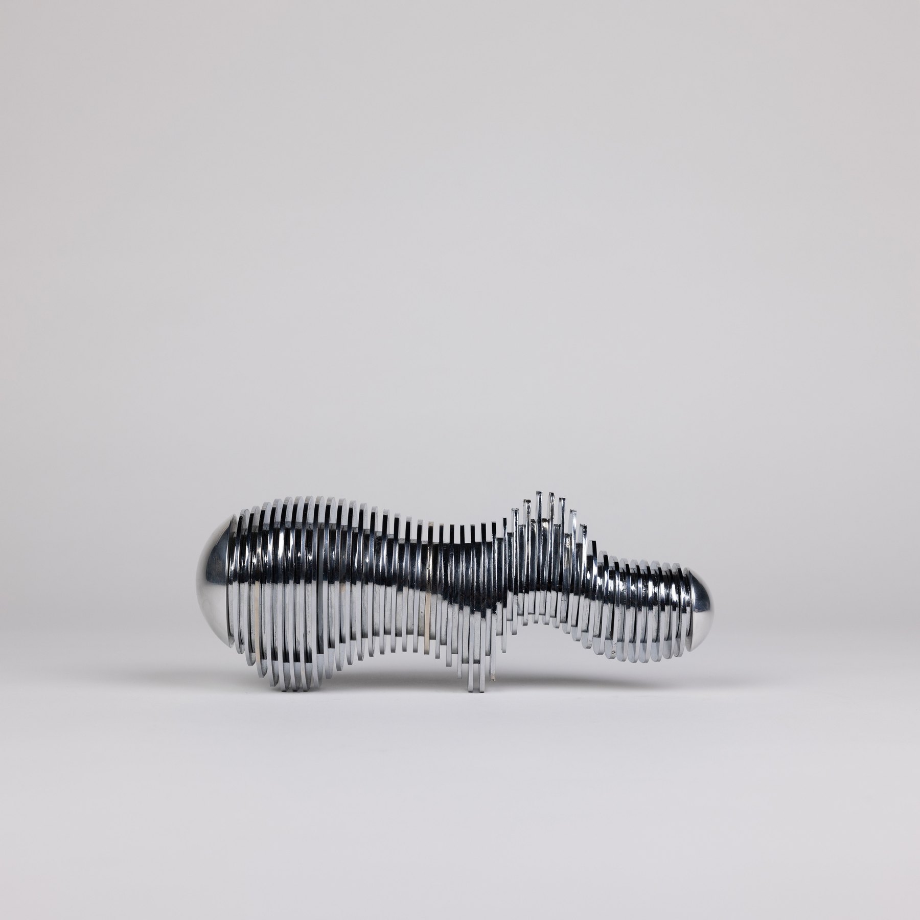 MOHM × Analogue Sliced Taweret in polished steel, seen from the side